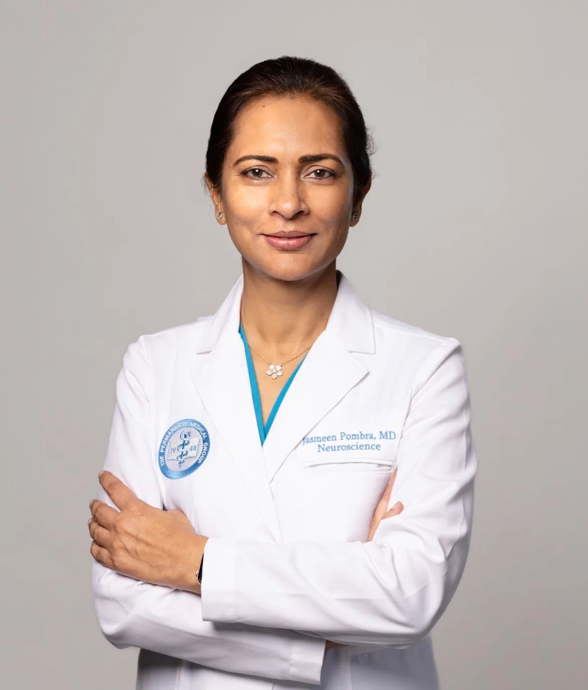 Jasmeen Pombra in her physician's white coat