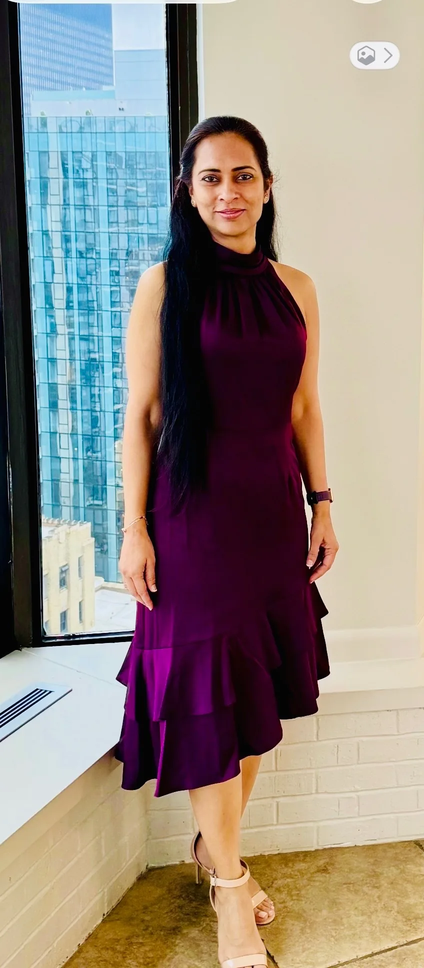 Jasmeen Pombra in a plum dress